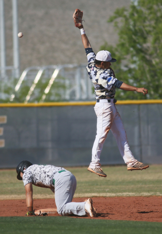 Shadow Ridge’s Eric Jordan, right, goes for a catch as Palo Verde’s Yodai Nakamu ...