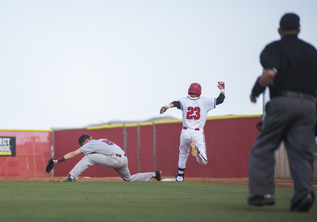 Desert Oasis Chase Adams (8) catches an out at first against Arbor View’s Joe Fitzhugh ...