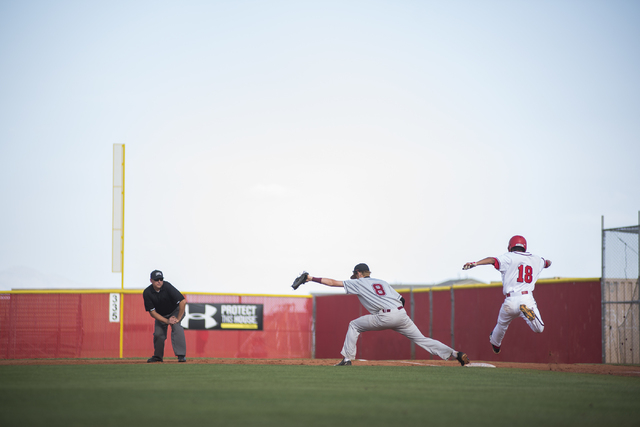 Desert Oasis Chase Adams (8) catches an out at first against Arbor View’s R. J. Rodrig ...