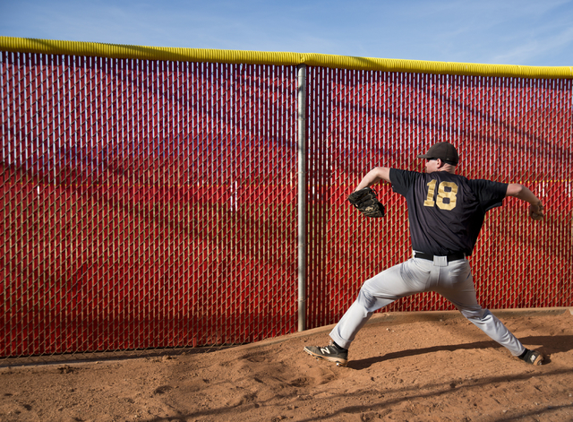 Faith Lutheran pitcher Josh Brown (18) warms up during their game at Arbor View High School ...