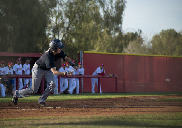 Faith Lutheran’s Liam Brendin (7) tries to bunt the ball during their game at Arbor Vi ...