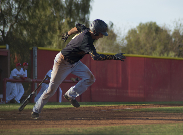 Faith Lutheran’s Brandon Davis (8) makes a run for first base during their game at Arb ...