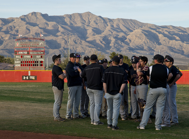 The Faith Lutheran High School baseball team meets after their win at Arbor View High School ...