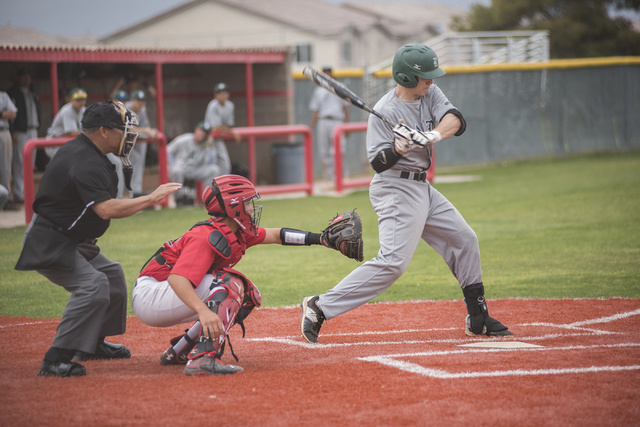 Rancho High School’s Zach Barnhart (21) swings at a pitch during their baseball game p ...