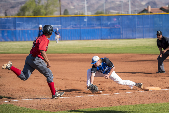 Las Vegas High School’s Antonio Maxilla (25) makes it to first base safely as Basic&#8 ...