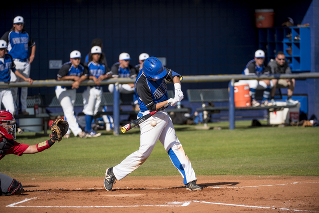 Basic’s Roger Riley (3) swings at a pitch during a game against Las Vegas at Basic Hig ...