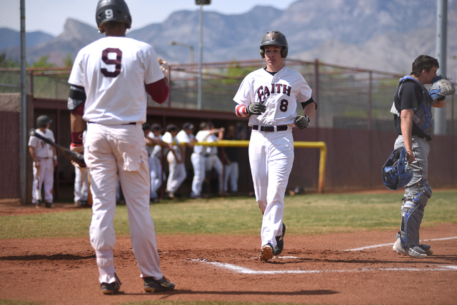 Faith Lutheran’s Brandon Davis (8) scores a run against Canyon View (Utah) during thei ...