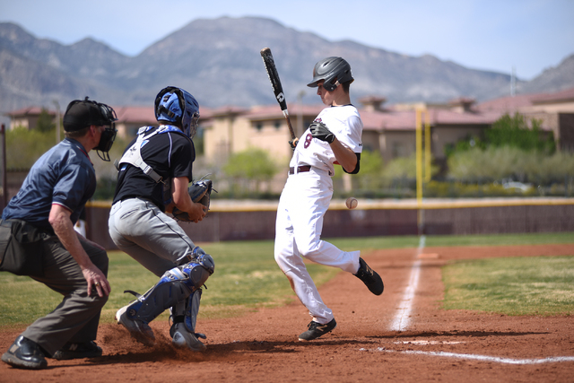 Faith Lutheran’s Brandon Davis (8) gets hit by a pitch against Canyon View (Utah) duri ...