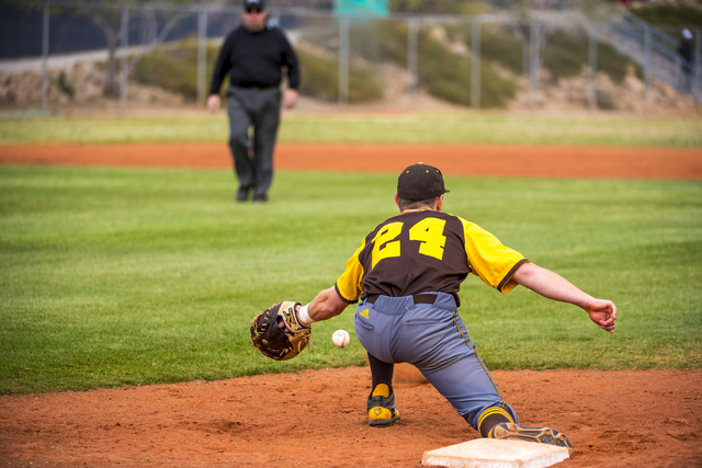 Bonanza first baseman Eric Schultz (24) catches a ball getting a Spring Valley runner out at ...
