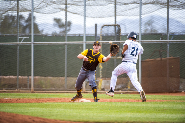 Bonanza first baseman Eric Schultz (24) catches the ball as Spring Valley runner Jake Sellin ...
