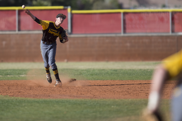 Bonanza’s Corey Oswald (5) throws the ball to first base against Arbor View at Arbor V ...