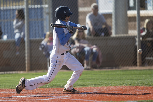 Centennial’s Bryce Rheault (5) bunts the ball for a hit against Arbor View in their ba ...