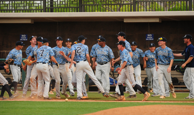 Centennial players celebrate their 6-5 win over Bishop Gorman during their prep baseball gam ...