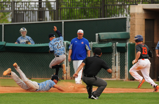 Centennial first baseman Frank Sessa dives to tag first base to force out Bishop Gorman base ...