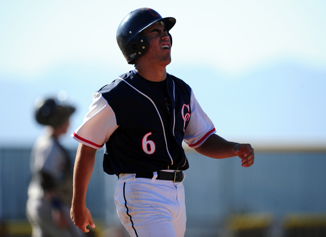 Coronado batter Anthony Carro reacts after being hit by a Liberty pitch in the fourth inning ...