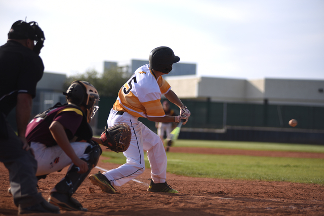 Clark’s Zachary Graham swings at a pitch against Pahrump Valley during their baseball ...