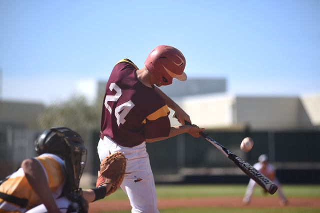 Pahrump Valley’s Willie Lucas (24) swings at a pitch against Clark during their baseba ...
