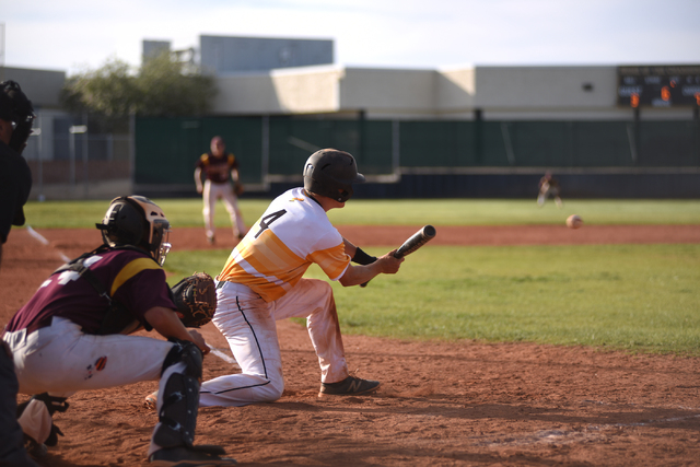 Clark’s Stefan McLin (4) attempts a bunt against Pahrump Valley during their baseball ...