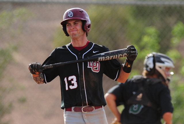 Desert Oasis batter Nic Lane reacts after striking out with a runner on third in the fifth i ...