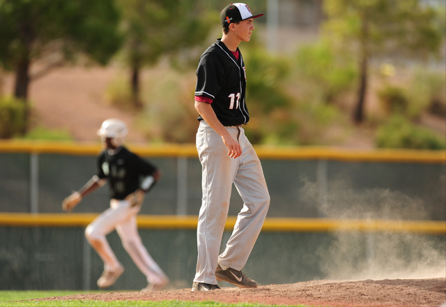 Desert Oasis starting pitcher Brett Brocoff reacts after giving up a two-run home run to Pal ...