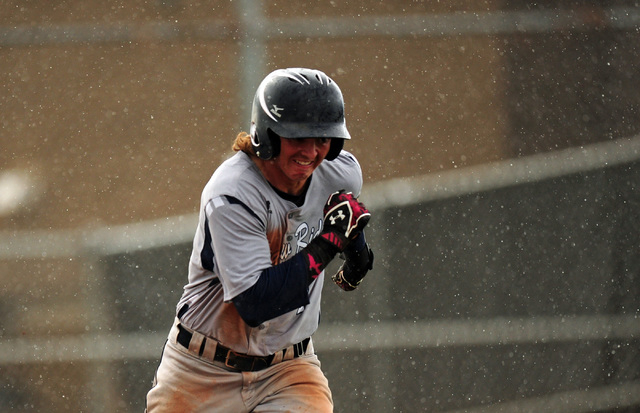 Shadow Ridge batter Chris Opolka runs to first base on a ground out fielded by Desert Oasis ...