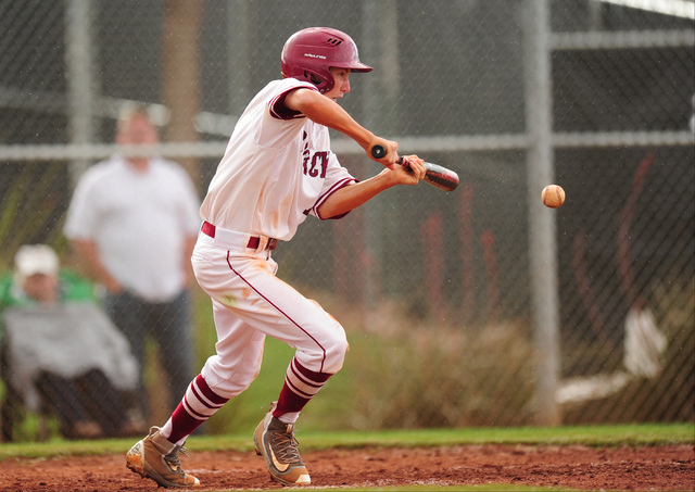 Desert Oasis batter Jason Sharman bunts against Shadow Ridge in the fourth inning of their p ...