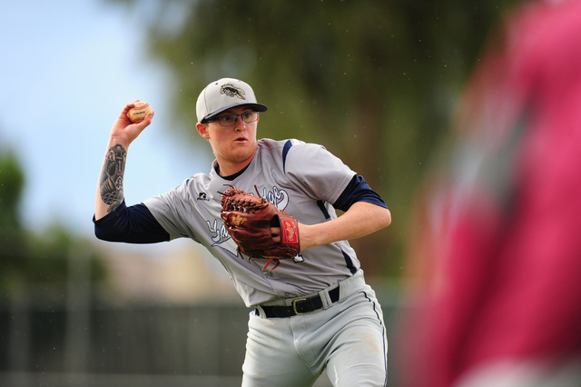 Shadow Ridge starting pitcher Nick Parr fields a Desert Oasis bunt in the fourth inning of t ...