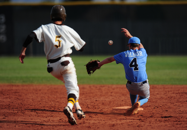 Bonanza base runner Corey Oswald steals second base while Centennial second baseman Kian Wil ...