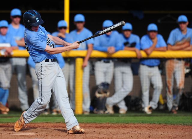 Centennial batter Jake Rogers fouls a pitch off of his foot in the seventh inning of their p ...