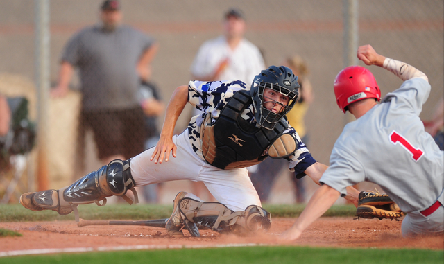 Arbor View baserunner Nick Roeper beats the tag of Shadow Ridge catcher Kyle Gaura to score ...