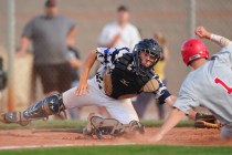 Arbor View baserunner Nick Roeper beats the tag of Shadow Ridge catcher Kyle Gaura to score ...