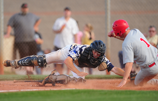 Arbor View baserunner Nick Roeper beats the tag of Shadow Ridge catcher Kyle Gaura to score ...