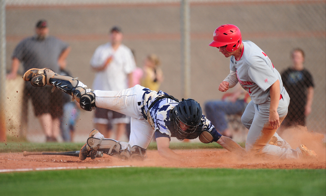 Arbor View baserunner Nick Roeper beats the tag of Shadow Ridge catcher Kyle Gaura to score ...