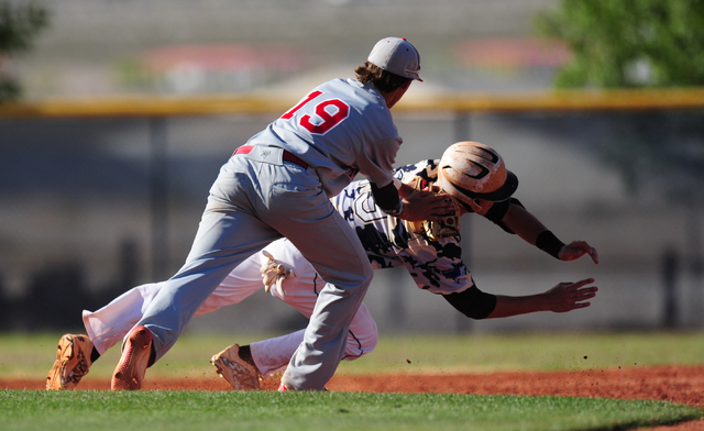 Arbor View third baseman Talon Lebaron tags out Shadow Ridge base runner Trevin Reynolds aft ...