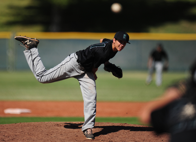 Rancho starting pitcher Layton Walls delivers to Las Vegas in the first inning of their prep ...