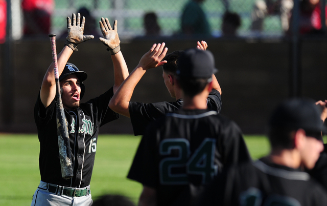 Rancho baserunner Braulio Santiaguin high fives teammates after scoring a run in the sixth i ...