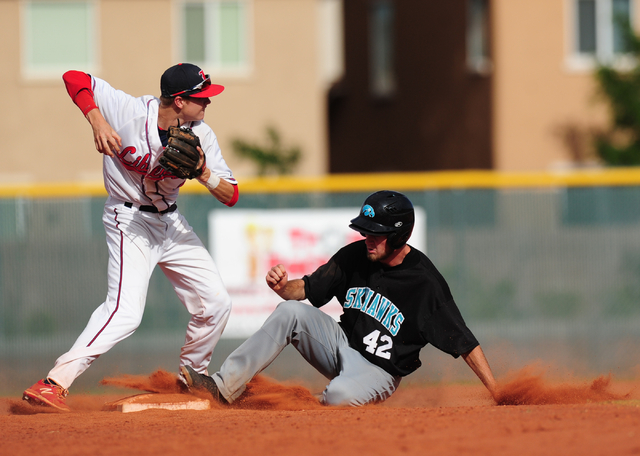 Silverado baserunner Michael Janosik breaks up a double play attempted by Liberty shortstop ...