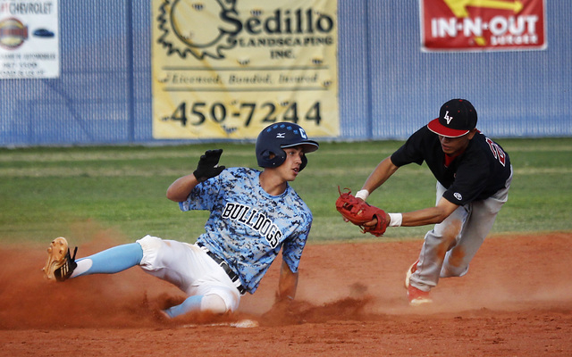 Centennial’s Alex Nicoll (13) slides under the tag of Las Vegas’ Hector Perez wh ...