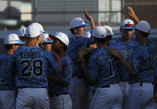 Centennial starting pitcher James Harbour, middle, gets congratulated by his teammates after ...