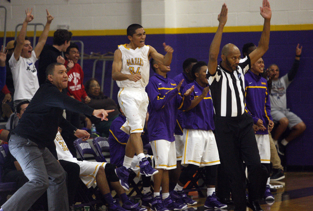 Durango players, including Apollo Corley (24) celebrate a 3-point basket in the fourth quart ...
