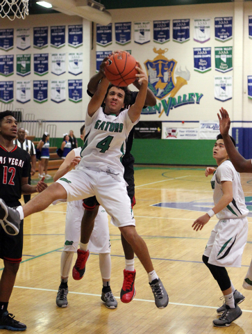 Green Valley shooting guard Xavier Jarvis (4) pulls down a rebound in the fourth quarter on ...