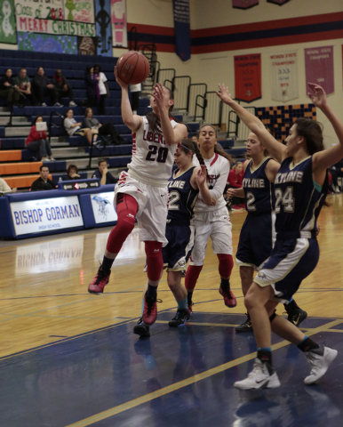 Liberty’s Kealy Brown (20) goes in for a layup during the first half on Thursday. (Don ...