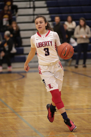 Liberty’s CeCe Quintino (3) brings the ball down the curt during the first half agains ...