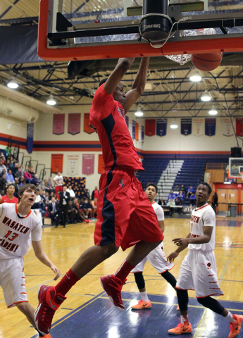 Findlay Prep forward Horace Spencer (0) dunks in front of Wasatch Academy forward/center Jos ...