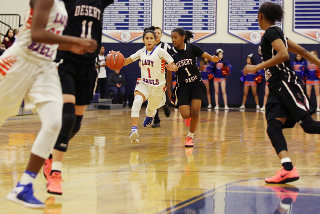 Bishop Gorman sophomore Caira Young takes the ball up the court on Monday, Feb. 6, 2017 at B ...