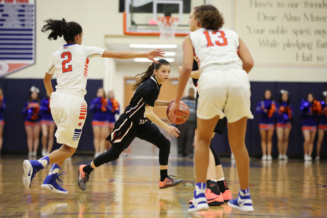 Desert Oasis sophomore Brianna Clark attempts to take the ball to the basket on Monday, Feb. ...