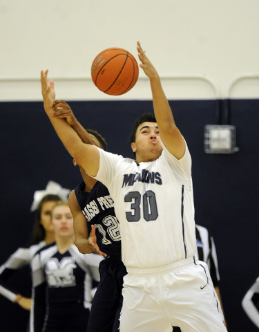 Agassi Prep guard Kobe Williams and The Meadows School center Alex Agrawal (30) battle for a ...