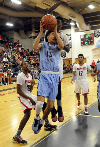 The hand of Las Vegas High forward Will Loche (44) strikes the face of Canyon Springs guard ...
