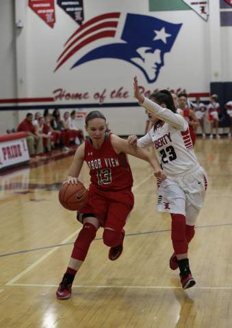 Arbor View’s Katrina Nordstrom (13) tries to move around Liberty’s Alexis Tomass ...