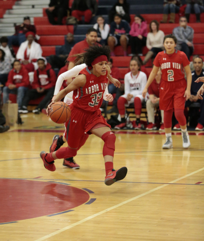 Arbor View’s Janae Strode (32) makes a move down court during the first half of Monday ...